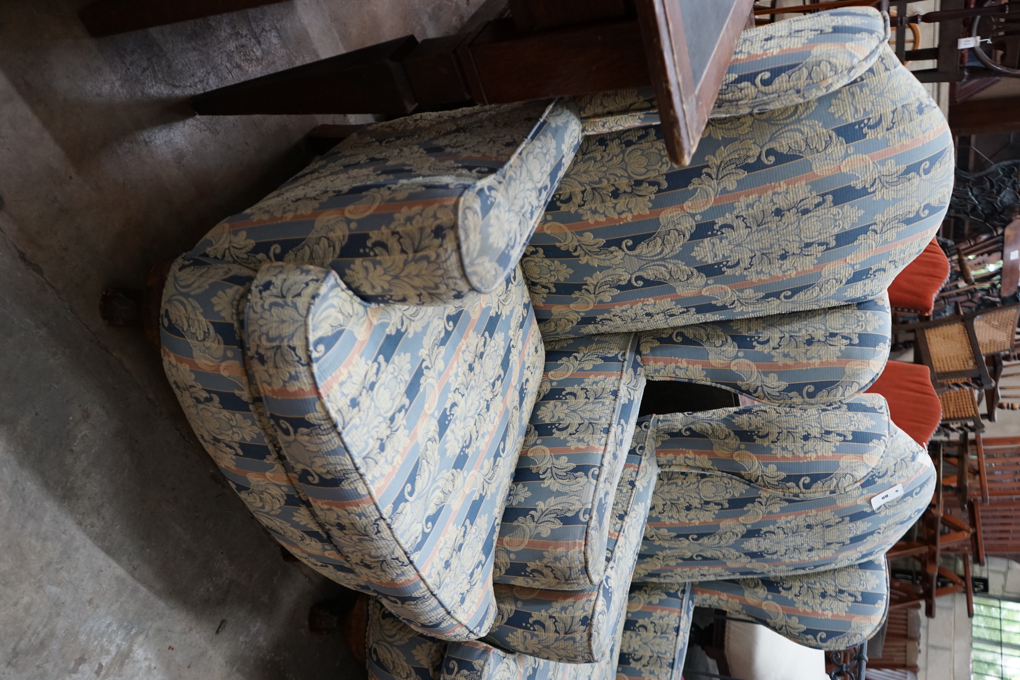 A pair of 1920's upholstered wing armchairs, width 74cm depth 70cm height 106cm